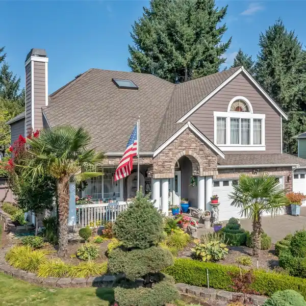 STONE-ACCENTED HOME FEATURING HOT TUB