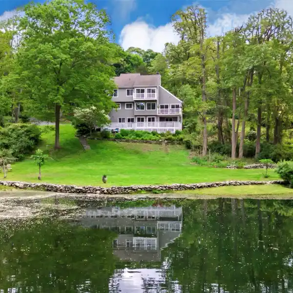 MODERN ELEGANCE MEETS NATURAL SERENITY IN PRESTIGIOUS BEDFORD CORNERS