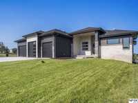 MODERN ELKHORN RANCH WITH COVERED DECK AND FOUR-CAR GARAGE