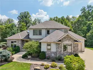 Low-Maintenance Luxury with Expansive Wooded Views