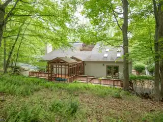 Unique Custom Contemporary on Private Wooded Property