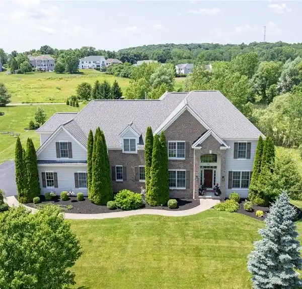 CUSTOM WOODSTONE HOME ON PREMIUM POND LOT