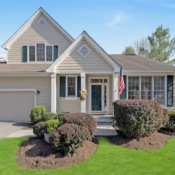 BEAUTIFULLY MAINTAINED END UNIT IN THE RIVERWOODS COMMUNITY