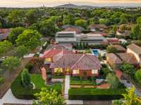 LOVINGLY EXPANDED AND UPDATED CLASSIC RED BRICK HOME