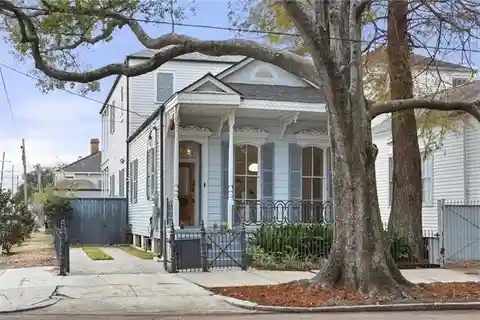 Eastlake Victorian Side Hall Cottage with Carriage House