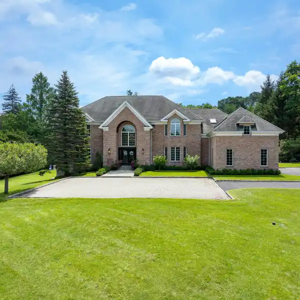STATELY BRICK COLONIAL ON NEARLY THREE PRIVATE ACRES