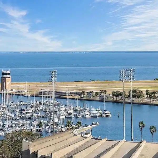 OPEN CONCEPT LIVING WITH ELEGANT MARBLE KITCHEN