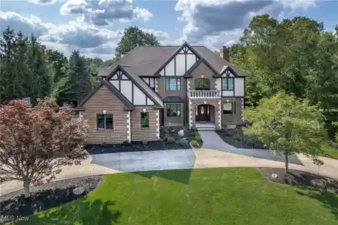 Elegant Brick Tudor with Spacious Outdoor Living