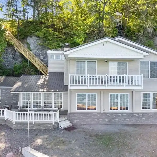 TURNKEY HOME WITH BEACHFRONT ON CAYUGA LAKE