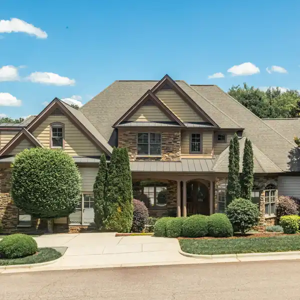 CUSTOM HOME WITH A PRIVATE WOODED YARD IN DESIRABLE DUNLEITH