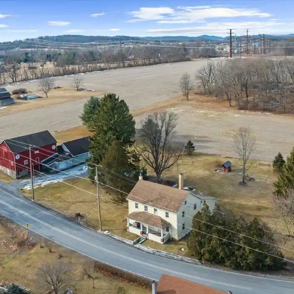 CLASSIC FARMHOUSE ON EXPANSIVE PRIME LAND