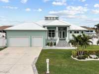 KEY WEST STYLE LUXURY HOME IN ISLAND PARK WOODLANDS