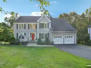 Exquisite Center Hall Colonial Set on Pristine Manicured Lot