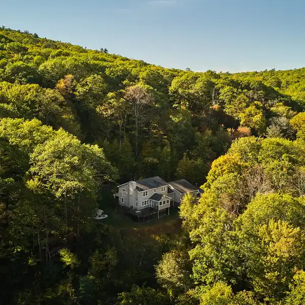 SERENE ESTATE SURROUNDED BY FOREST AND ROCK OUTCROPPINGS
