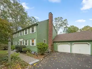 Classic Colonial Charm with Garden Oasis Appeal
