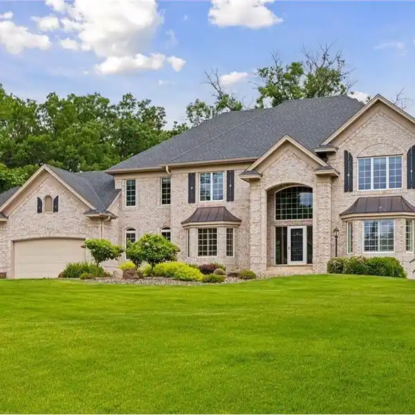 STUNNING BRICK-FRONT HOME ON LAKE CORNER