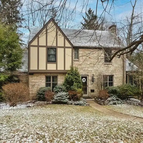 TUDOR HOME IN A WOODED SETTING