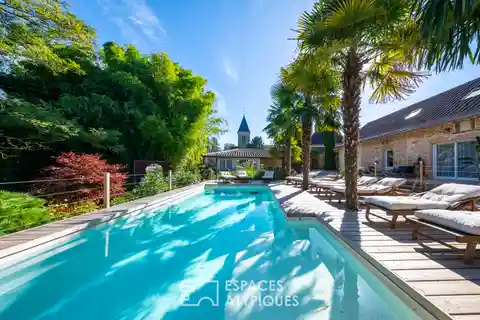 Idyllic Riverside Estate with Global-Inspired Serenity