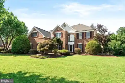Spectacular Brick Front Colonial Situated on a Picturesque Lot