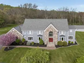 Elegant Colonial Retreat on Private Wooded Acreage