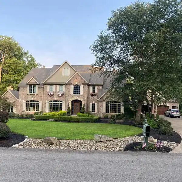 ELEGANT CUSTOM HOME ON PRIVATE WOODED PROPERTY