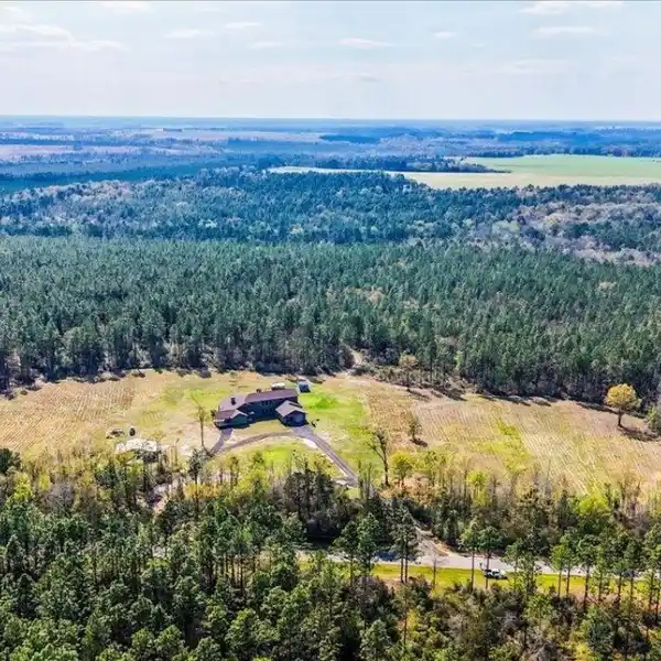 HIGH-END HOME ON 61.5 ACRES