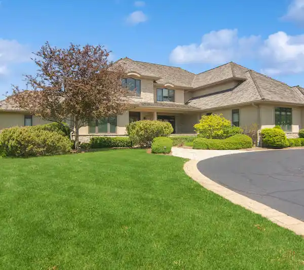GORGEOUS EAST WINNETKA CUSTOM HOME ON A SERENE ACRE