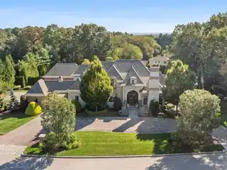 Custom Brick & Stone Masterpiece with 5 Ensuite Bedrooms