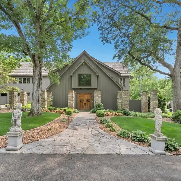 EXPANSIVE LODGE HOME ON EIGHT WOODED ACRES