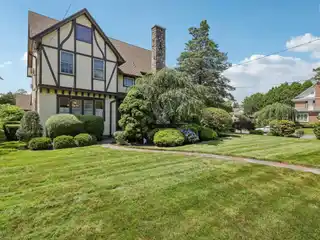 Expansive Center Hall Tudor Home