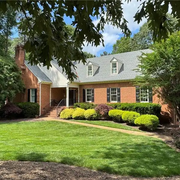 EXPANSIVE BRICK BEAUTY WITH WOODED BACKYARD VIEWS