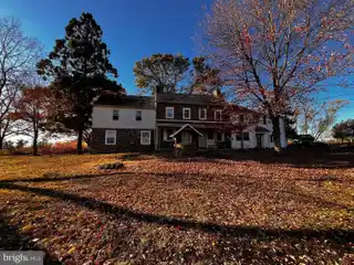 Brick Fireplace Anchors Formal Living Room