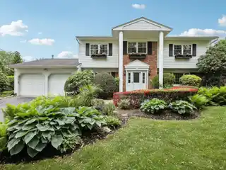 Classic Colonial Retreat with Lush Outdoor Oasis