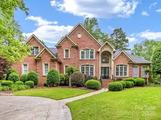 Serene Estate with Sunroom and Porch Views