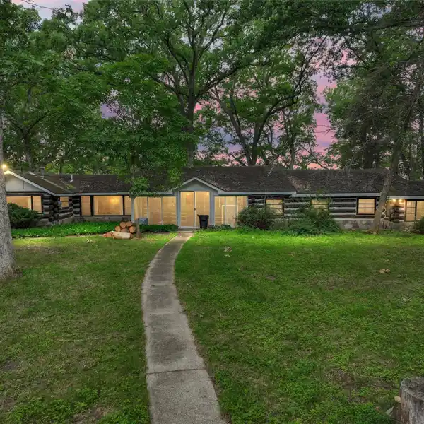 BONAFIDE LOG CABIN SITS ON OVER 7 ACRES OF WATERFRONT PROPERTY