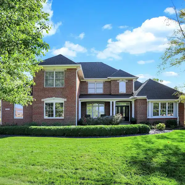 ELEGANT CREEKSIDE RETREAT WITH WALKOUT BASEMENT