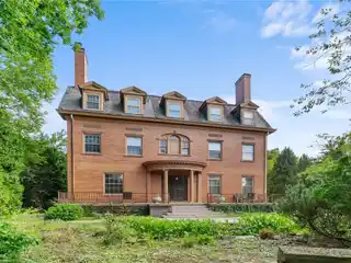Own an Entire City Block with a Magnificent Mini Mansion