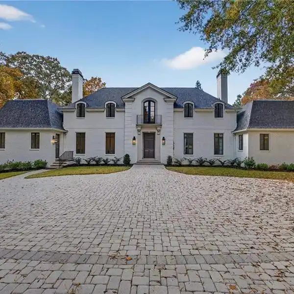 EXCEPTIONAL GATED LUXURY WITH HEATED POOL AND TIMELESS DESIGN