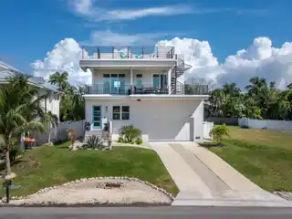 Stunning Luxury Retreat in Highly Sought After Village of Longboat Key