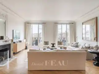 Haussmannian Elegance with Continuous Balcony Views