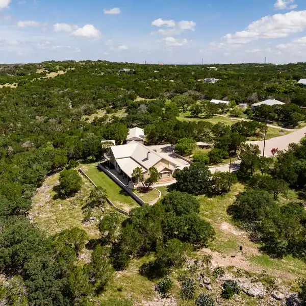 BEAUTIFUL TWO-STORY ROCK HOME ON 6+ ACRES