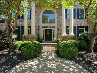 Grand Residence with Sunlit Architectural Drama