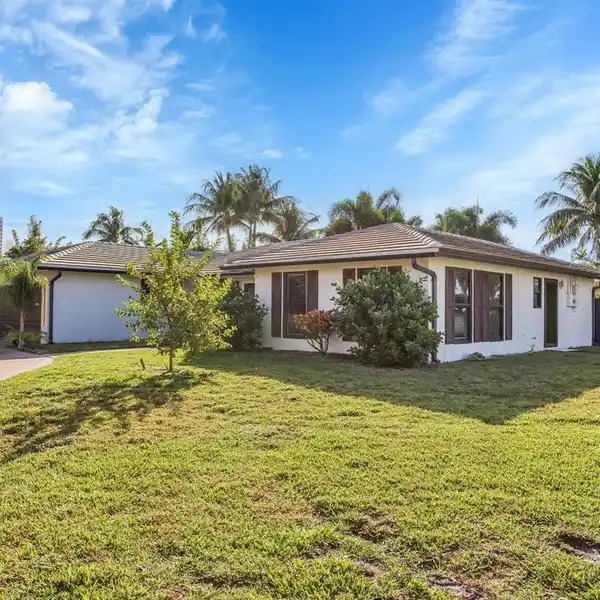 CORNER-LOT COASTAL HOME WITH BRIGHT OPEN LIVING