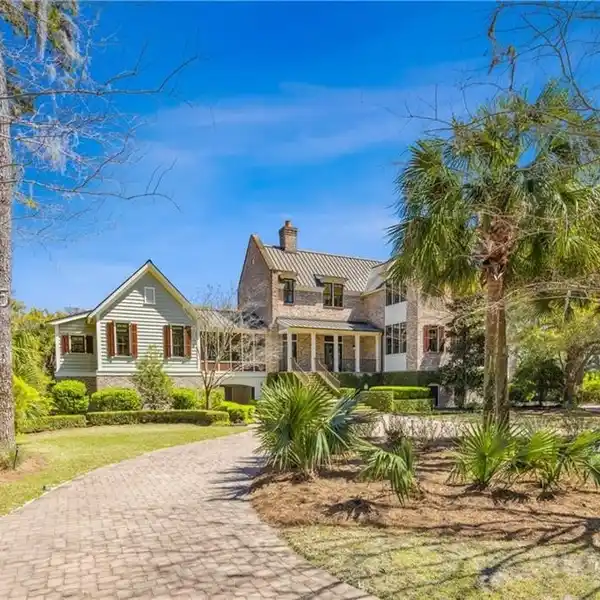 WAKE UP TO STUNNING MARSH VIEWS FROM YOUR EXPANSIVE COVERED PORCH AND SCREENED-IN RETREAT.