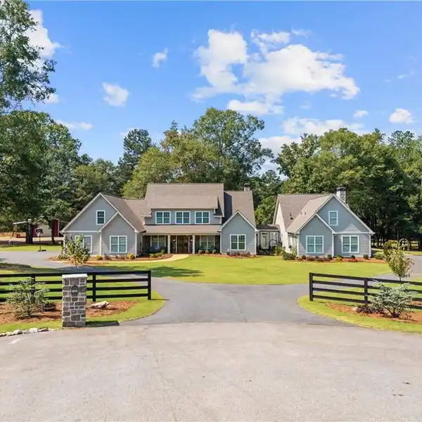 CUSTOM FARMHOUSE ON OVER SIX ACRES