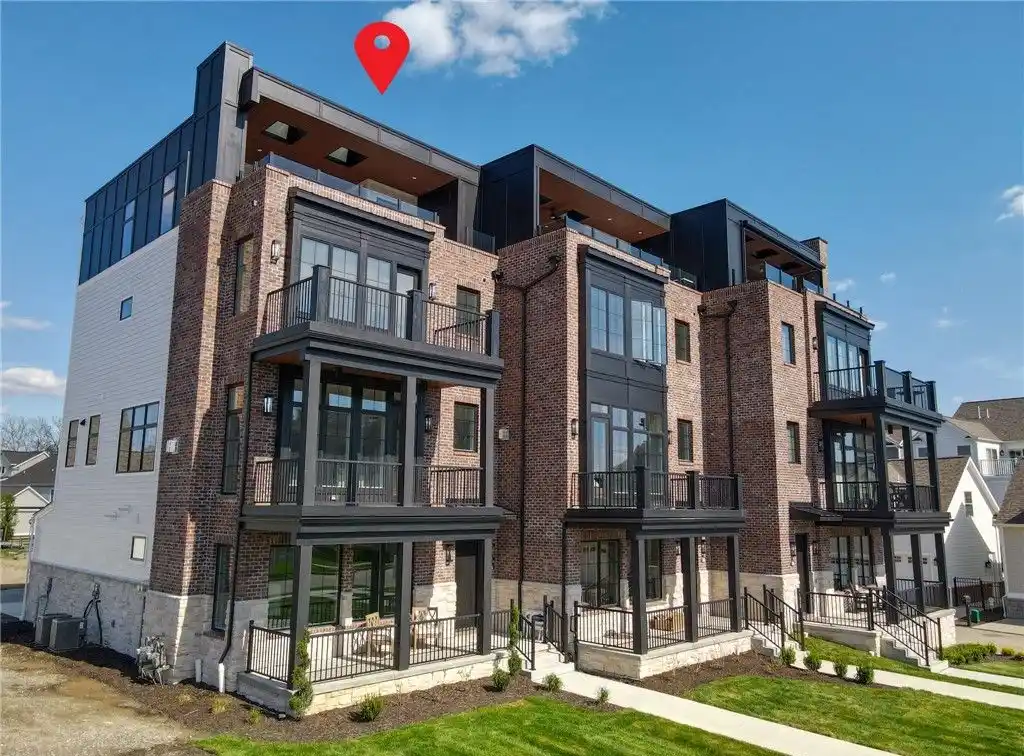 Distinctive Brownstone at the River's Edge