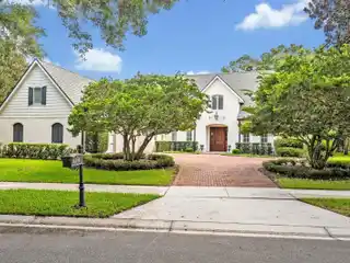 Soaring Ceilings, Brick Exterior, and Lush Landscaping