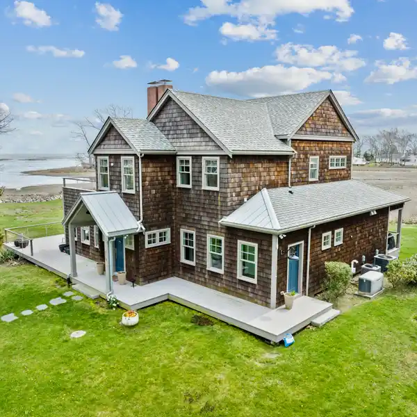 UNPARALLELED LUXURY IN THIS WATERFRONT MASTERPIECE...