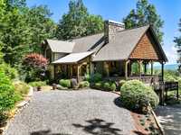 SECLUDED RETREAT WITH SPECTACULAR MOUNTAIN VISTAS AND RUSTIC CHARM