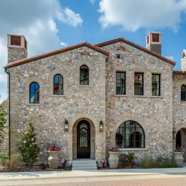 FABULOUS CUSTOM HOME WITH STONE WALLED COURTYARD